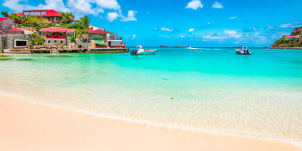 sbh- Beautiful idyllic beach with white sand, turquoise sea and blue sky. Luxury summer vacation destination in Saint Barthelemy, the Caribbean.